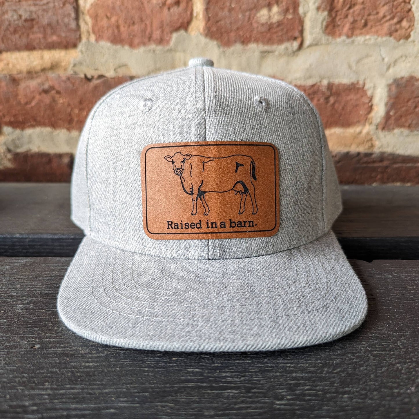 "Raised in a barn" Kids Trucker Hat: Heather Gray